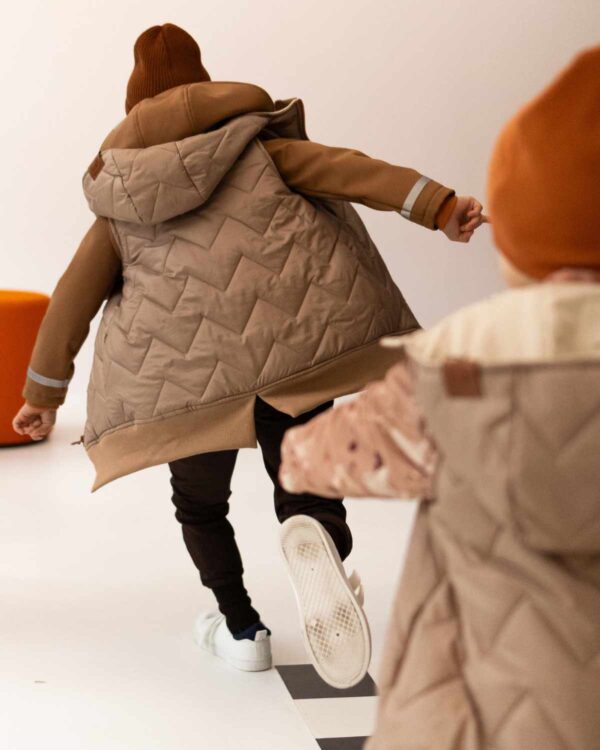 beżowa kamizelka dziecięca przedłużana